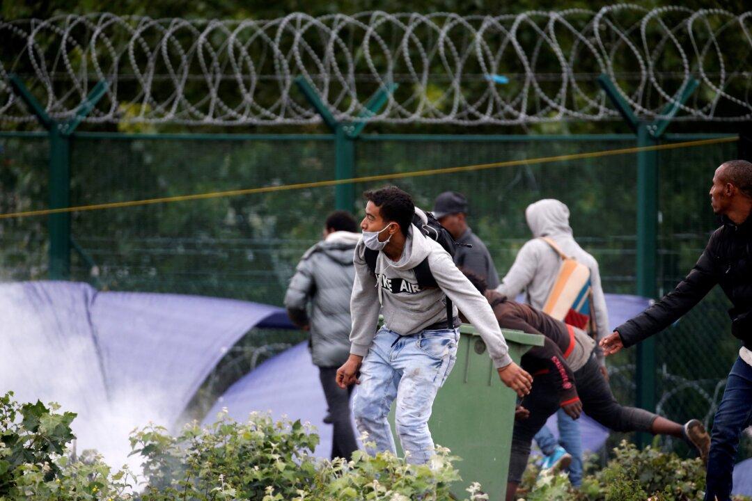 French Police Clear Migrant Camp at Launch Point for Britain