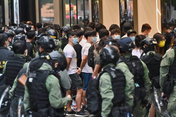 A group of Hongkongers is arrested by local police in Causeway Bay, Hong Kong, on Oct. 1, 2020. (Song Bilung/The Epoch Times)