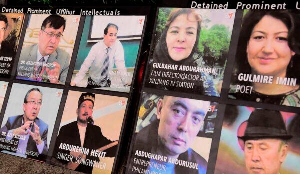 A display shows photographs of prominent Uighur intellectuals detained by China as protesters gather across from the Chinese Consulate in Los Angeles on Oct. 1, 2020, during a global day of action called "Resist China". (FREDERIC J. BROWN/AFP via Getty Images)