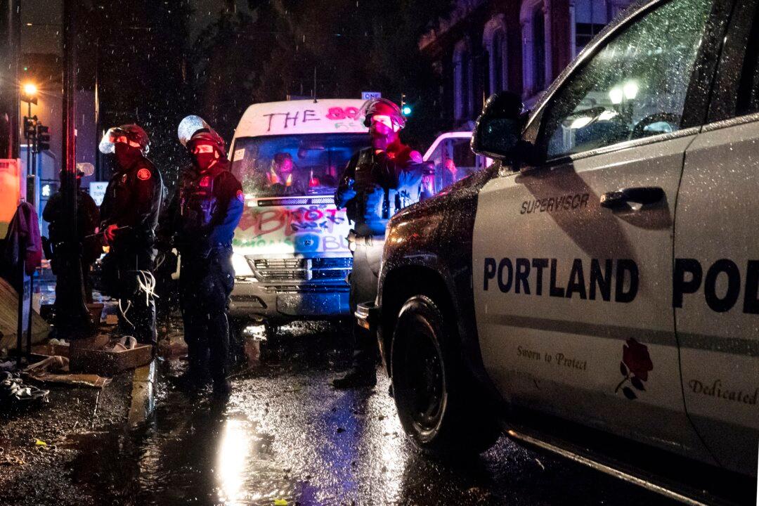 Antifa, BLM Activists Armed With Rifles Block Traffic, Assault Drivers in Portland