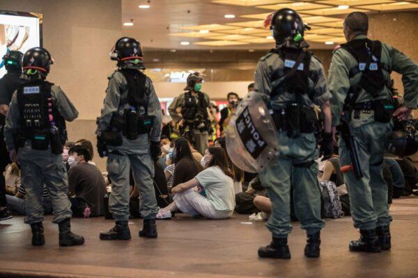 Riot police detain people after they cleared protesters taking part in a rally against a new national security law in Hong Kong on July 1, 2020. (Dale De La Rey/AFP via Getty Images)