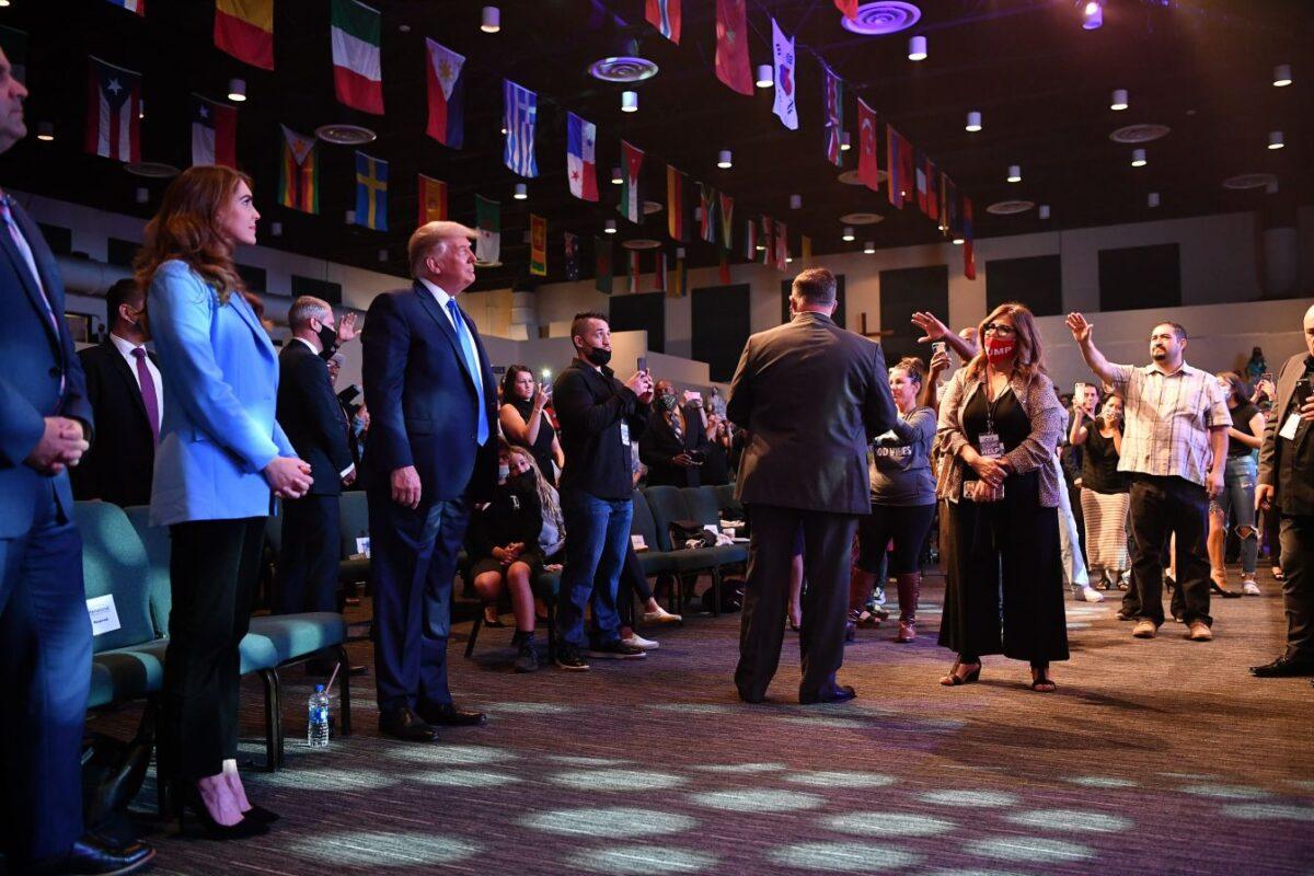 President Donald Trump(2ndL) attends services at the International Church of Las Vegas in Las Vegas, Nevada on Oct. 18, 2020. (MANDEL NGAN/AFP via Getty Images)