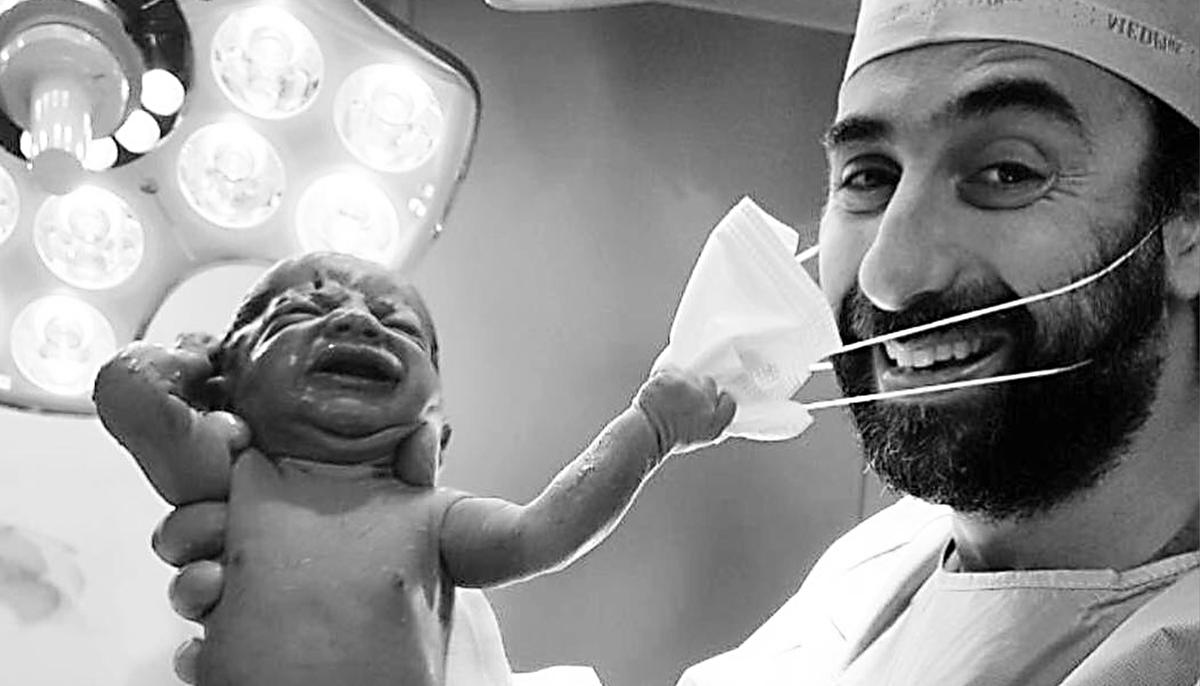 Newborn Snatches Doctor’s Mask, Photo Sends Message of Hope Amid COVID-19