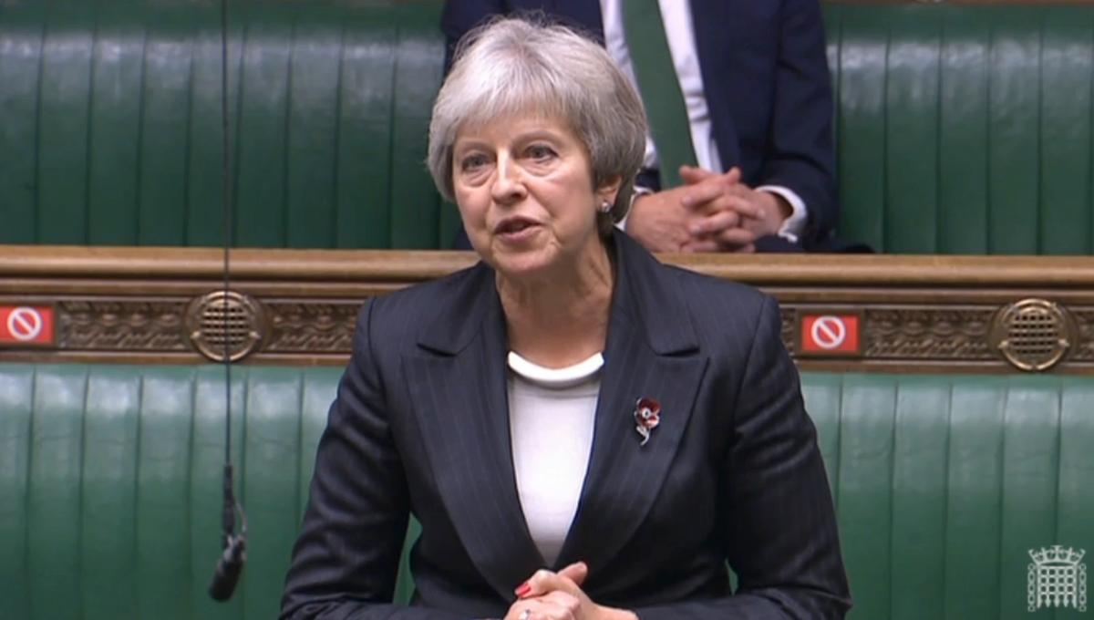 Former Prime Minister Theresa May Urges Johnson to Drop COVID-19 Tests for Travellers