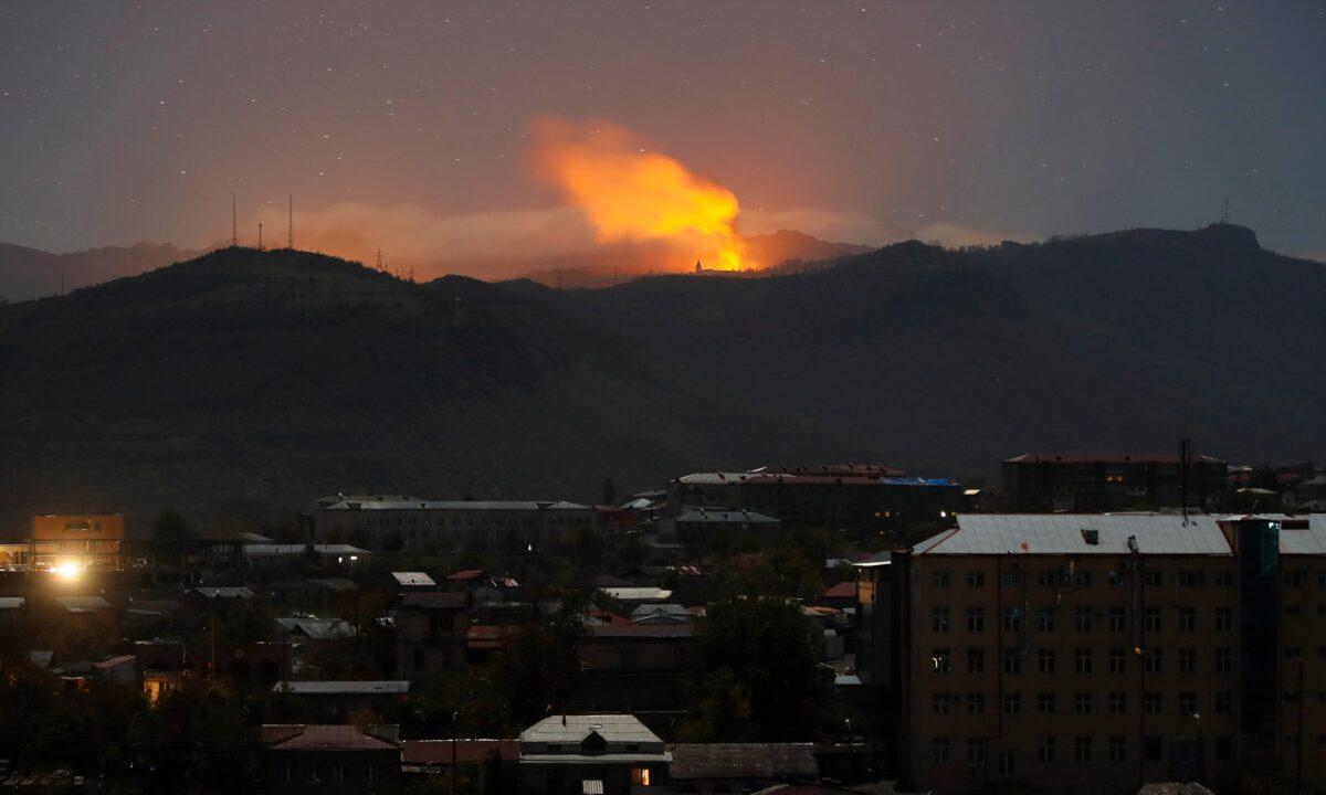Explosions are seen during fighting between Armenian and Azerbaijani forces near Shushi outside Stepanakert, the separatist region of Nagorno-Karabakh, on Nov. 7, 2020. (AP Photo)
