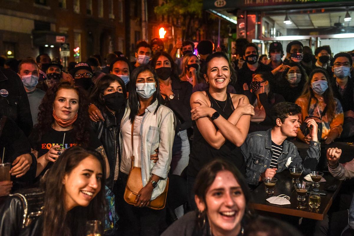 Biden Campaign Urges People to Wear Masks, Social Distance Amid Packed Celebrations