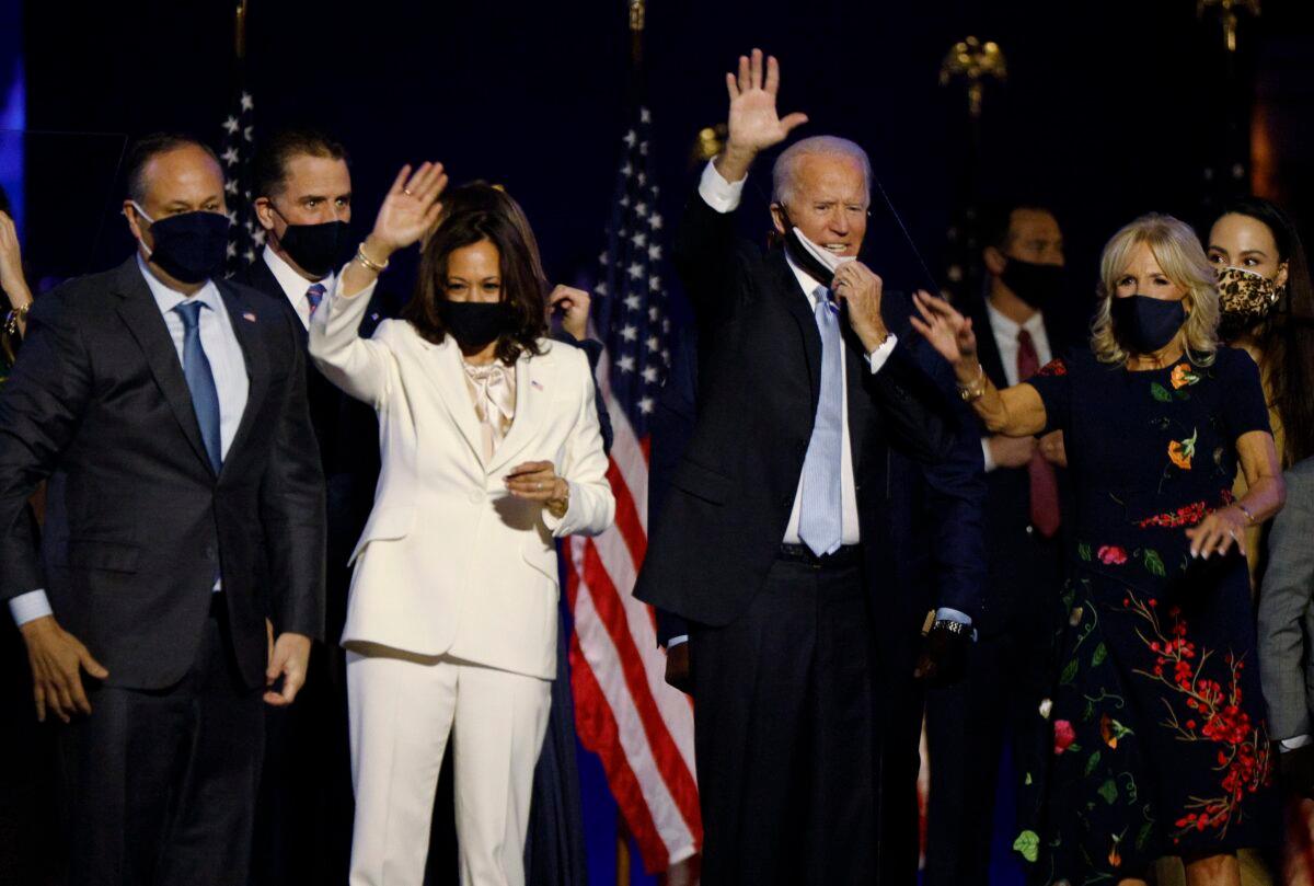 Democratic presidential nominee Joe Biden and his wife Jill, and vice presidential nominee Kamala Harris and her husband Doug, celebrate at an election rally in Wilmington, Del., on Nov. 7, 2020. (Jim Bourg/Reuters)