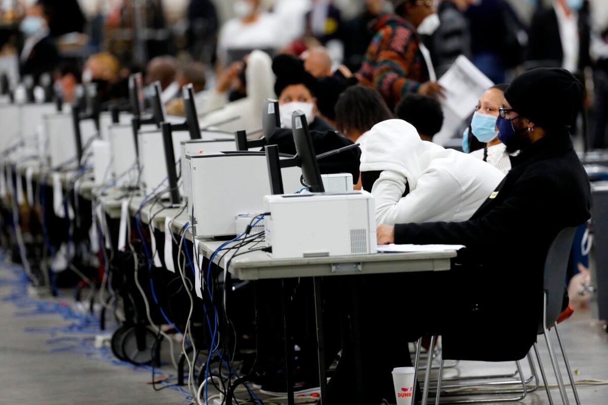 Detroit election workers work on counting absentee ballots for the 2020 general election at TCF Center in Detroit on Nov. 4, 2020. (Jeff Kowalsky/AFP via Getty Images)