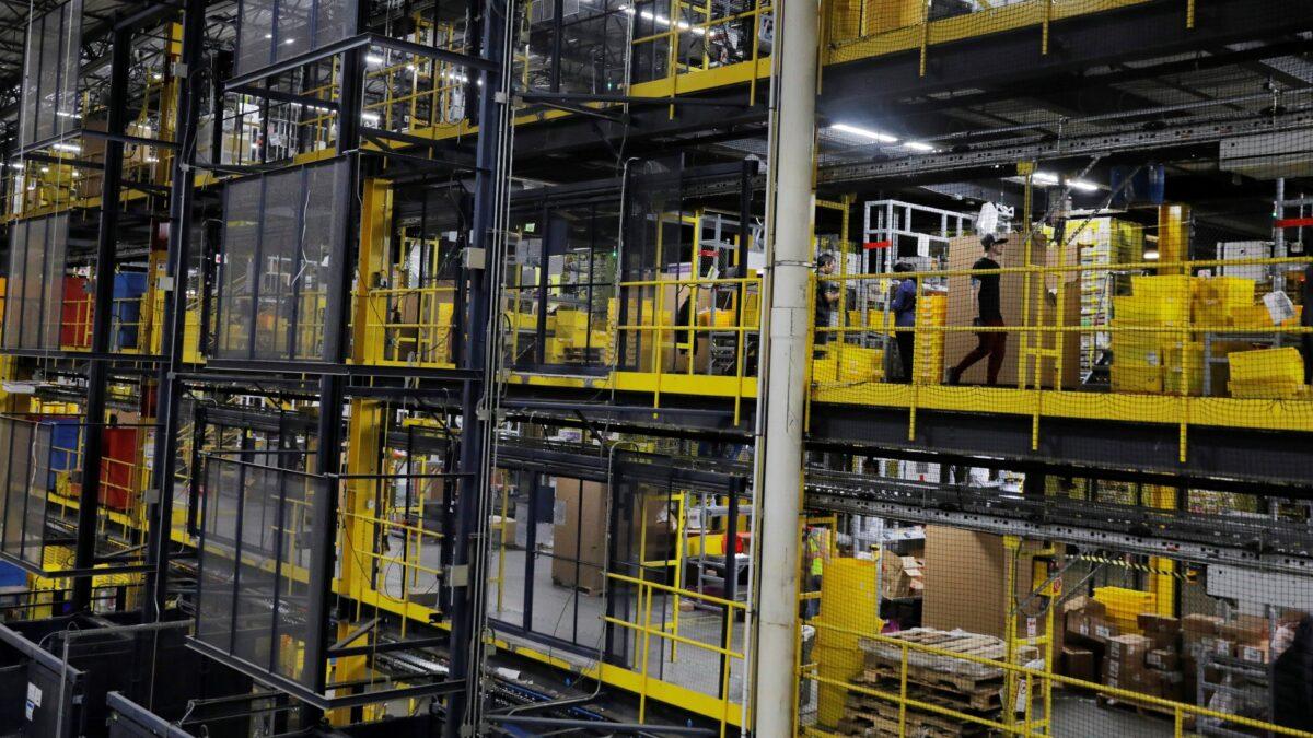 Amazon workers perform their jobs inside an Amazon fulfillment center on Cyber Monday in Robbinsville, N.J., on Dec. 2, 2019. (Lucas Jackson/Reuters)