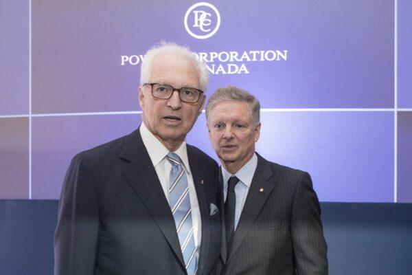 Andre Desmarais and Paul Desmarais Jr., then-co-CEOs of Power Corporation who have since retired, before the start of their company's annual meeting in Toronto on May 14, 2019. (The Canadian Press/Chris Young)