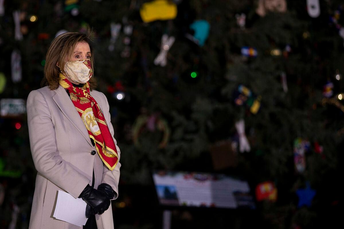 House Speaker Nancy Pelosi (D-Calif.) participates in the lighting of the Capitol Christmas tree on the West Lawn of the U.S. Capitol Building in Washington on Dec. 2, 2020. (Tasos Katopodis/Getty Images)