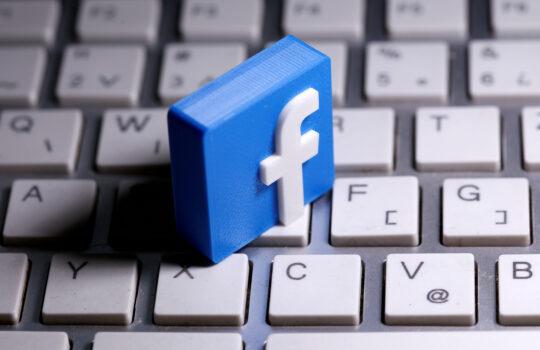 A 3D-printed Facebook logo is seen placed on a keyboard on March 25, 2020. (Dado Ruvic/Reuters)