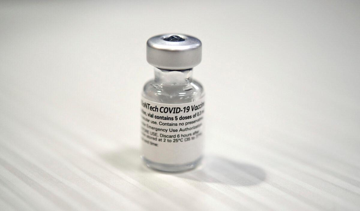 One of the first vials of the Pfizer BioNTech COVID-19 vaccine at Wake Forest Baptist Medical Center, in Winston-Salem, N.C., on Dec. 15, 2020. (Walt Unks/Winston-Salem Journal via AP)