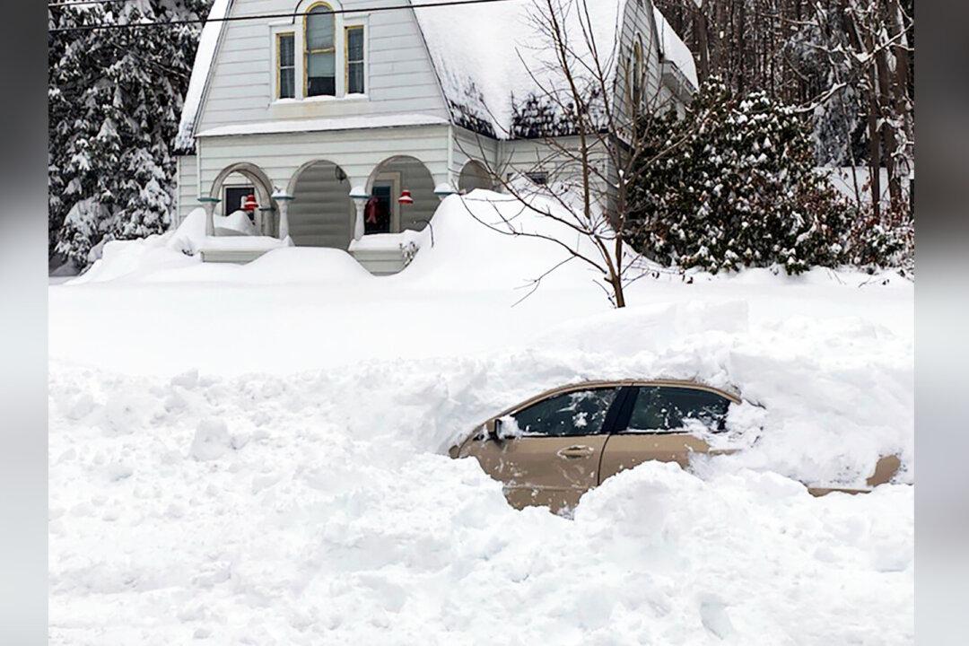 Motorist Rescued After 10 Hours in Car Buried by Snow Plow