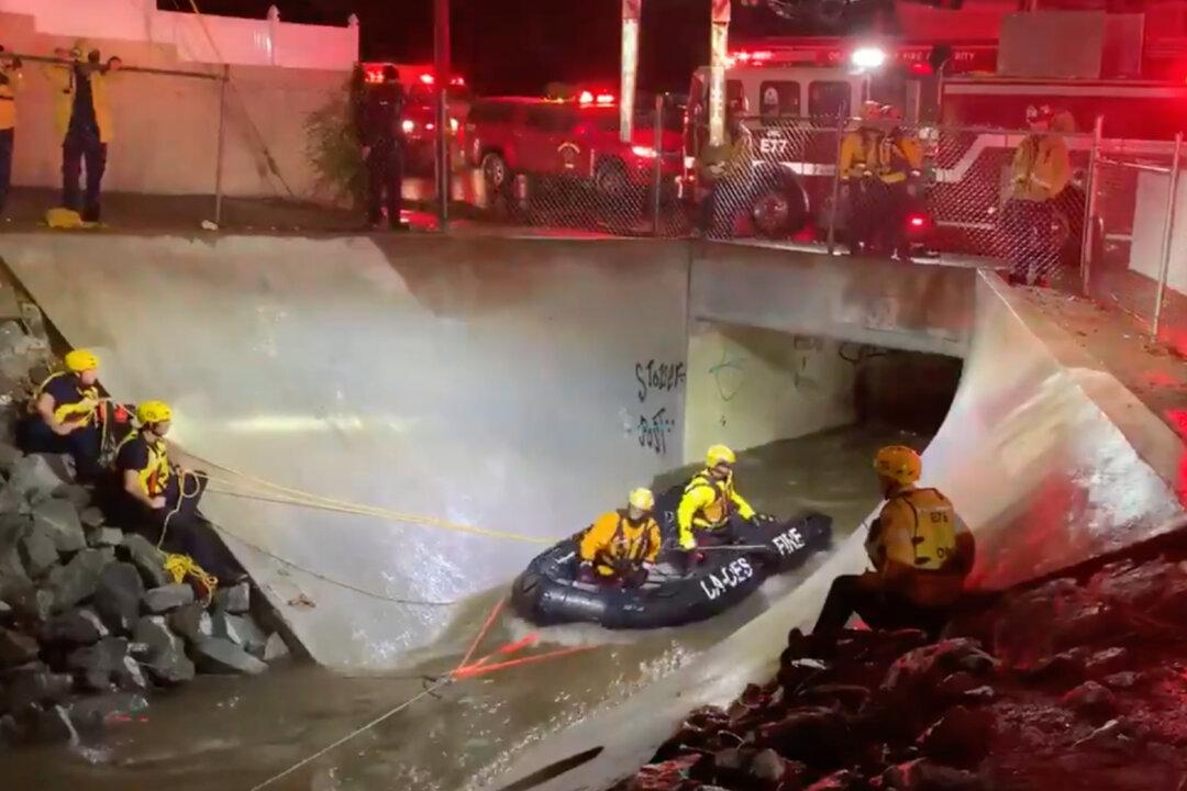 OCFA Rescues 2 Adults From Santa Ana Flood Channel After Heavy Rain