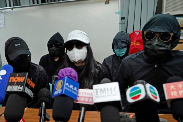 Relatives of 12 Hong Kong activists detained at sea by Chinese authorities, attend a press conference in Hong Kong on Dec. 28, 2020. (AP Photo/Kin Cheung)
