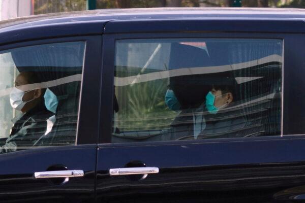 One of the 12 Hong Kong activists detained in mainland China over an illegal border crossing is seen in a vehicle after a transfer conducted at the China-Hong Kong border of Shenzhen Bay Port, in Hong Kong on Dec. 30, 2020. (Tyrone Siu/Reuters)