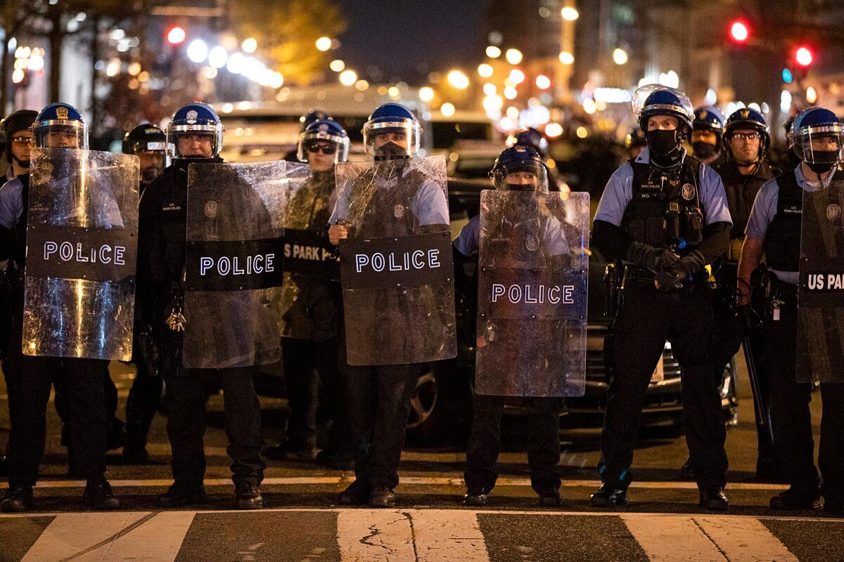 Washington police officers stand guard near Black Lives Matter Plaza in Washington on Dec. 12, 2020. (Tasos Katopodis/Getty Images)