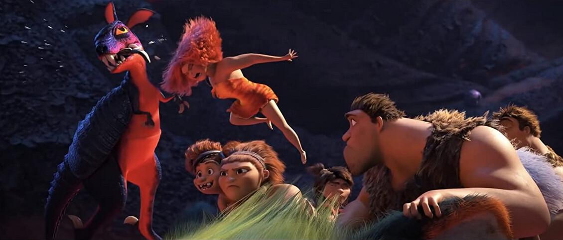 (L–R) Eep (voiced by Emma Stone) head-butts a dangerous kangadillo, while little sister Sandy (Kailey Crawford), mom Ugga (Catherine Keener), boyfriend Guy (Ryan Reynolds), dad Grug (Nicholas Cage), brother Thunk (Clark Duke), and granny Gran (Cloris Leachman) ride Chunky the saber-cat, in “The Croods: A New Age." (Universal Pictures)