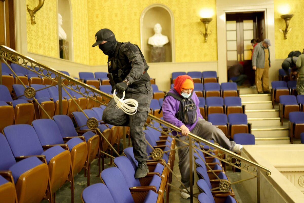 Protesters enter the Senate Chamber in Washington on Jan. 6, 2021. (Win McNamee/Getty Images)