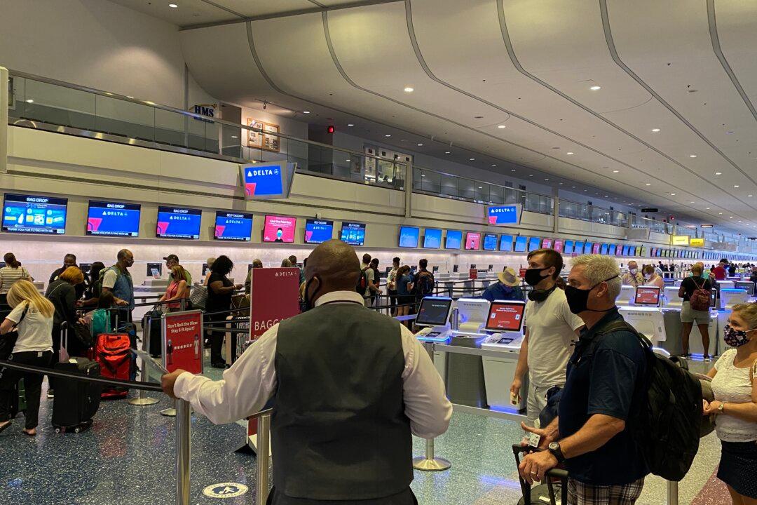 Chinese Woman Charged With Fraud, Illegally Bringing Chinese Nationals to the US