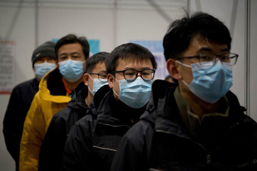 2 More Chinese Cities Go Under Lockdown, as Beijing Mandates 4-Week Quarantine for Travelers