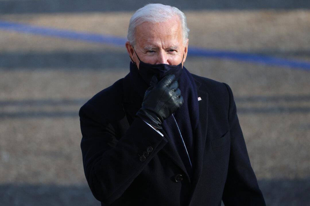 Biden Mandates Masks, Rejoins Paris Climate Accord, Among Other Executive Actions on First Day in Office