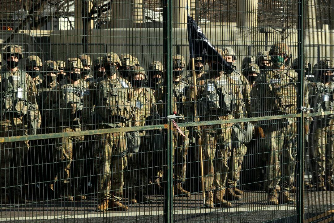 Workers in Washington Start Removing Security Barriers After Biden’s Inauguration