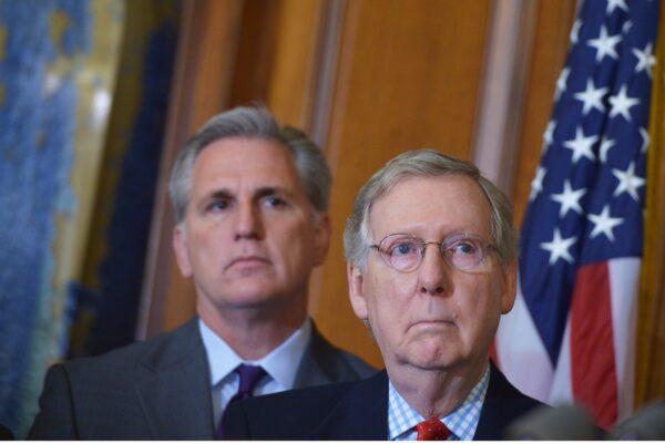 Then-Senate Majority Leader Mitch McConnell (R-Ky.) stands next to then-House Majority Leader Kevin McCarthy (R-Calif.) in the Rayburn Room of the U.S. Capitol in Washington, D.C., on Feb. 13, 2015. (Mandel Ngan/AFP via Getty Images)