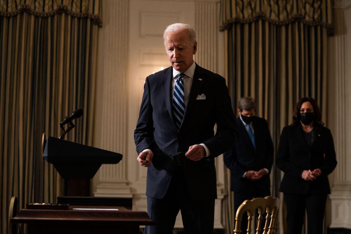 President Joe Biden prepares to sign executive orders after speaking about climate change issues at the White House on Jan. 27, 2021. (Anna Moneymaker-Pool/Getty Images)