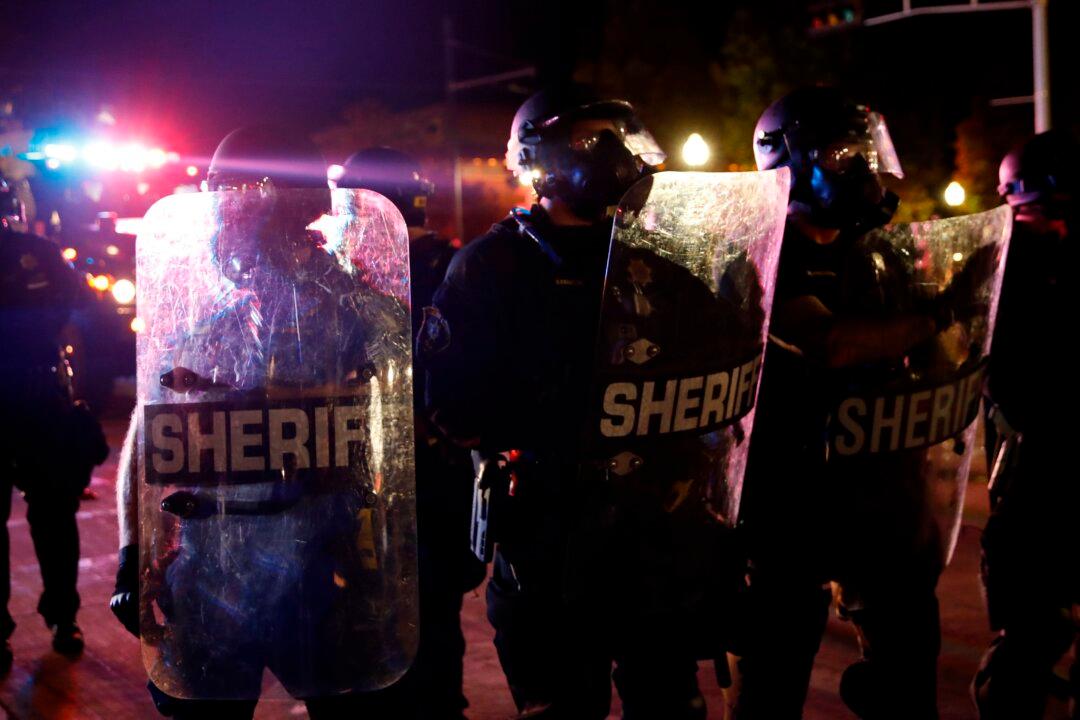 Wisconsin Man Charged for Assaulting Police Officer During Kenosha Riots