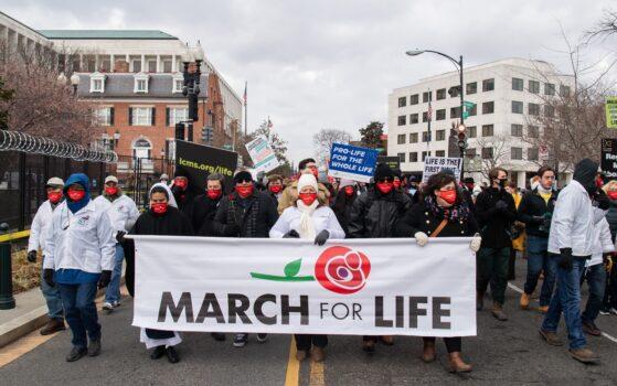 Pro-life activists participate in the "March for Life," an annual event to mark the anniversary of the 1973 Supreme Court case Roe v. Wade, which legalized abortion in the US, outside the US Supreme Court in Washington on Jan. 29, 2021. (Saul Loeb/AFP via Getty Images)