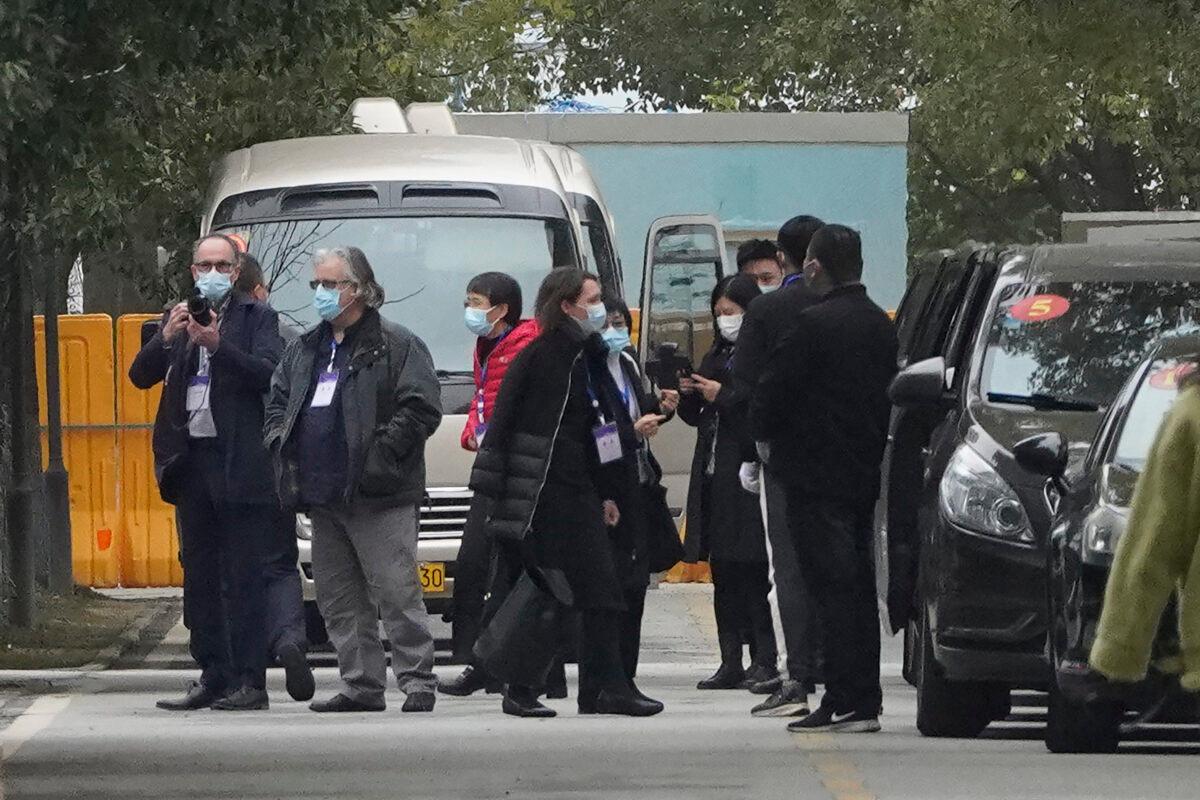 Members of the World Health Organization team depart from the Wuhan Jinyintan Hospital after a field visit in Wuhan, China, on Jan. 30, 2021. (Ng Han Guan/AP)