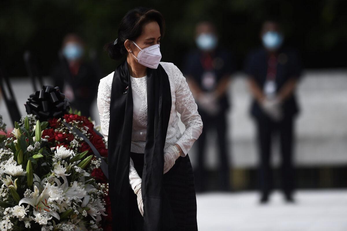 Burma's State Counsellor and Foreign Minister Aung San Suu Kyi leaves after paying her respects to her late father during a ceremony to mark the 73rd anniversary of Martyrs' Day in Yangon on July 19, 2020. (Ye Aung Thu/Pool via Reuters)
