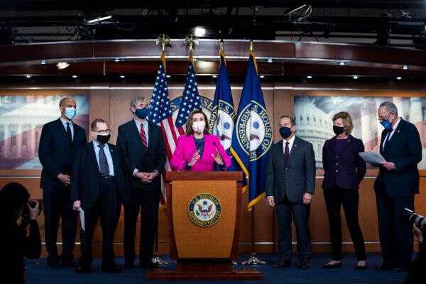 House Speaker Rep. Nancy Pelosi (D-Calif.) speaks as Sen. Cory Booker (D-N.J.), Rep. Jerrold Nadler (D-N.Y.), Sen. Jeff Merkley (D-Ore.) (L), Rep. David Cicilline (D-R.I.), Sen. Tammy Baldwin (D-Wis.), Senate Majority Leader Charles Schumer (D-N.Y.) (R) listen during a news conference ahead of the House vote on the Equality Act on Capitol Hill in Washington on Feb. 25, 2021. (Al Drago/Getty Images)