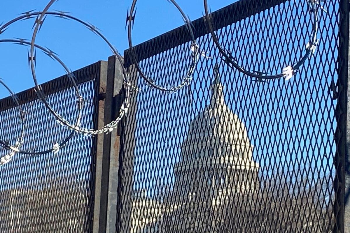Riot fencing and razor wire reinforce the security zone on Capitol Hill, in Washington, on Jan. 23, 2021. (Eileen Putman/AP Photo)