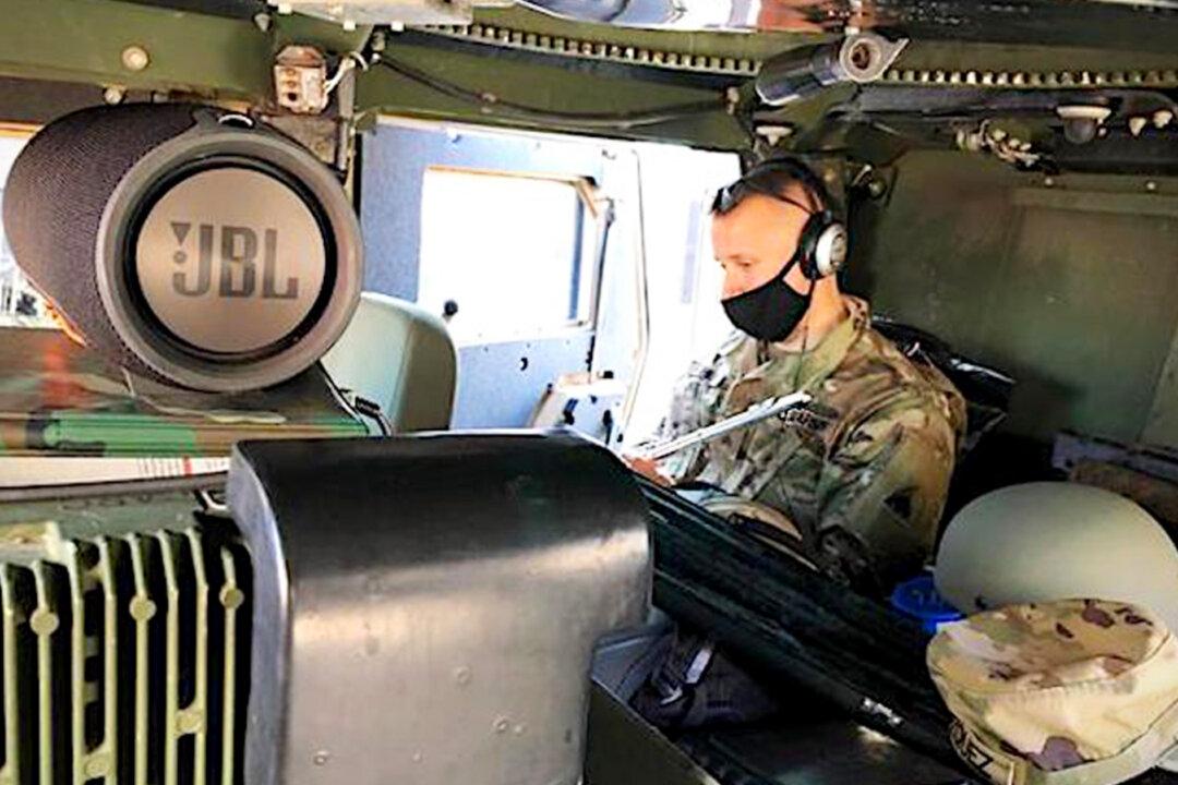 Music Teacher in National Guard Teaches Music Class From Humvee in Washington