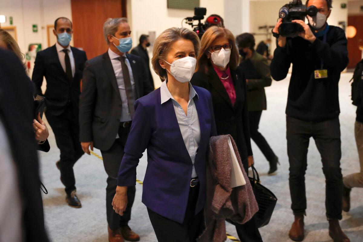 European Commission President Ursula von der Leyen, center left, and European Commissioner for Health Stella Kyriakides, center right, pass by the media as they arrive for a debate on the united EU approach to COVID-19 vaccinations at the European Parliament in Brussels, on Feb. 10, 2021. (Francisco Seco/AP Photo)