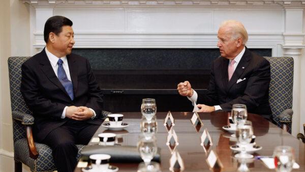 U.S. Vice President Joe Biden (R) and Chinese Vice-Chair Xi Jinping talk during an expanded bilateral meeting with other U.S. and Chinese officials in the Roosevelt Room at the White House in Washington on Feb. 14, 2012. (Chip Somodevilla/Getty Images)