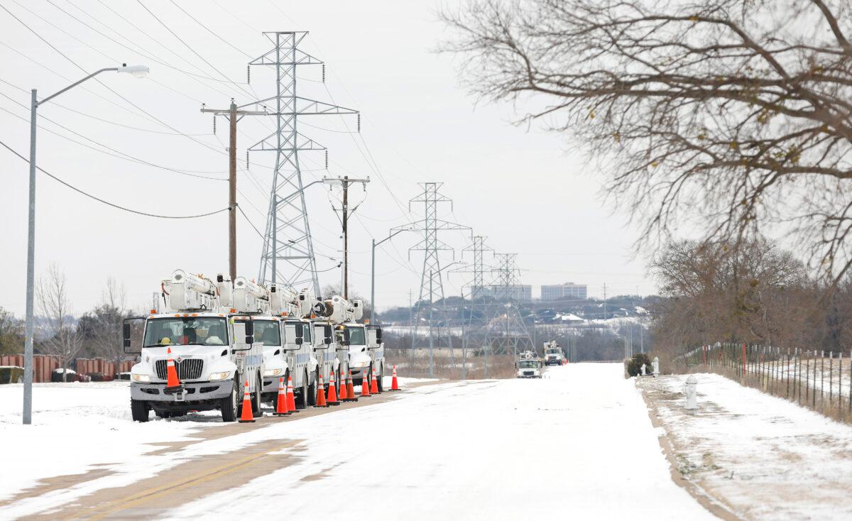 Pike Electric service trucks line up after a snowstorm in Fort Worth, Texas, on Feb. 16, 2021. (Ron Jenkins/Getty Images)