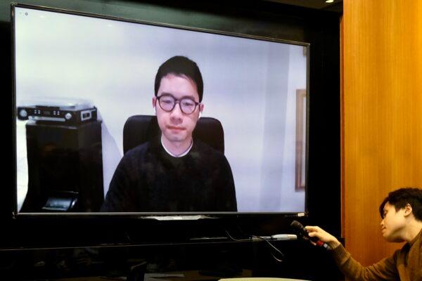 Exiled Hong Kong pro-democracy activist Nathan Law speaks via the internet during a press conference at Taiwan's Parliament in Taipei on Jan. 8, 2021. (Sam Yeh/AFP via Getty Images)