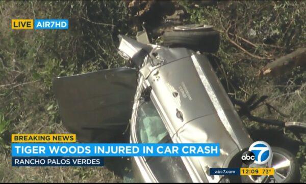 In this aerial image take from video provided by KABC-TV, a vehicle rest on its side after a rollover accident involving golfer Tiger Woods along a road in the Rancho Palos Verdes section of Los Angeles, Calif., on Feb. 23, 2021. (KABC-TV via AP)