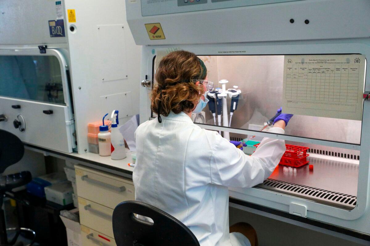 A scientist is seen working in a file photo taken at the Churchill Hospital in Oxford, west of London on June 24, 2020. (Steve Parsons/POOL/AFP via Getty Images)