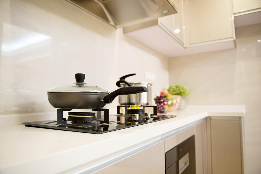 Instead of Replacing a Damaged Laminate Countertop, Repair It With Inlaid Tile
