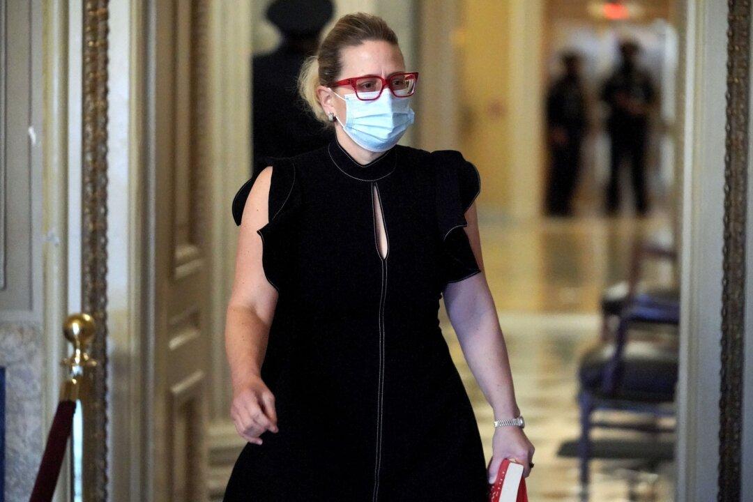 Sinema Rejects Criticism of Her Thumbs-Down ‘No’ Vote on Minimum Wage Measure