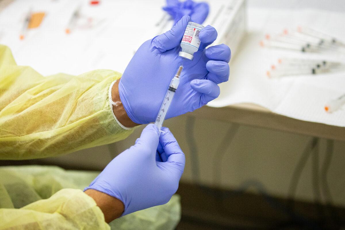 A dose of the Moderna COVID-19 vaccine is prepared in Orange, Calif., in this file image. (John Fredricks/The Epoch Times)