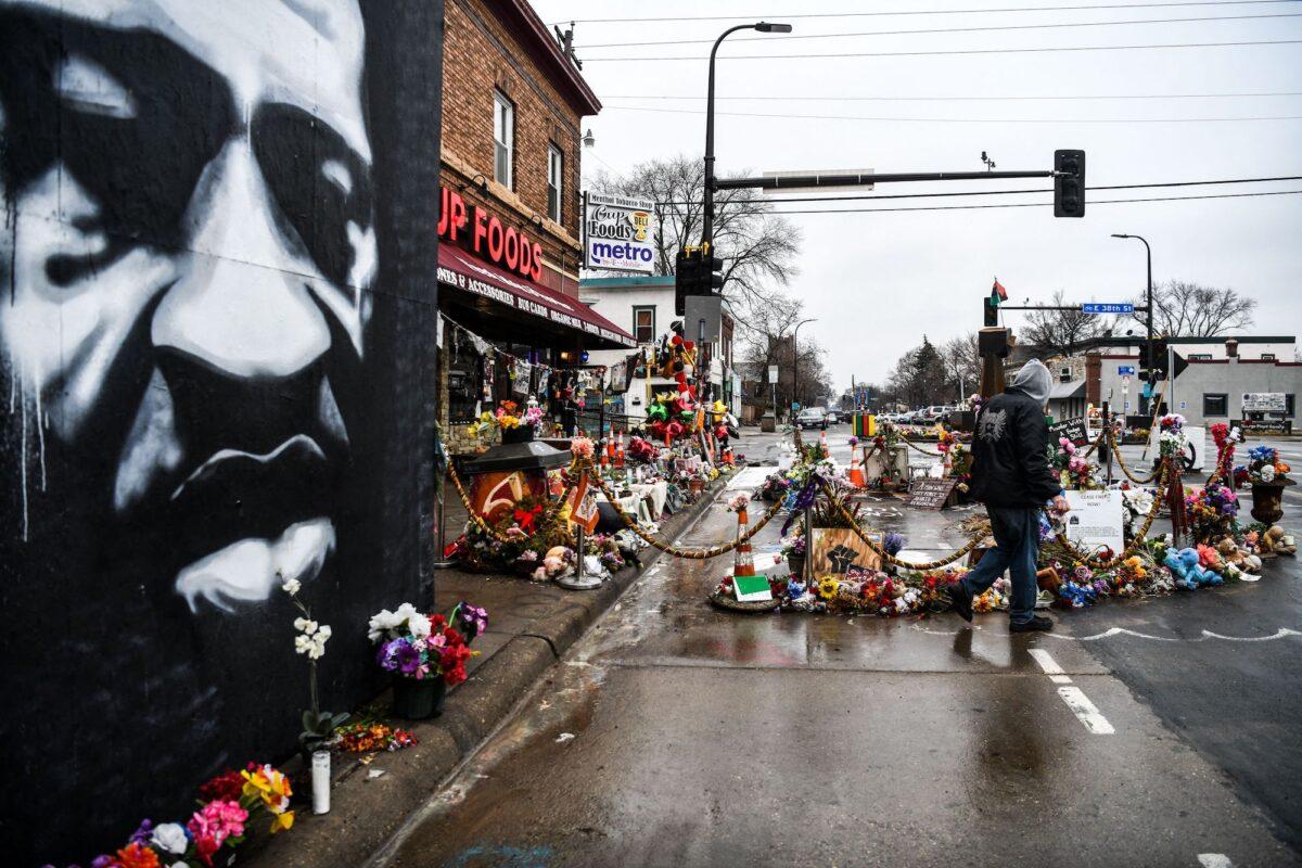 A man walks near the makeshift George Floyd memorial in Minneapolis, on March 10, 2021. (Chandan Khanna/AFP via Getty Images)