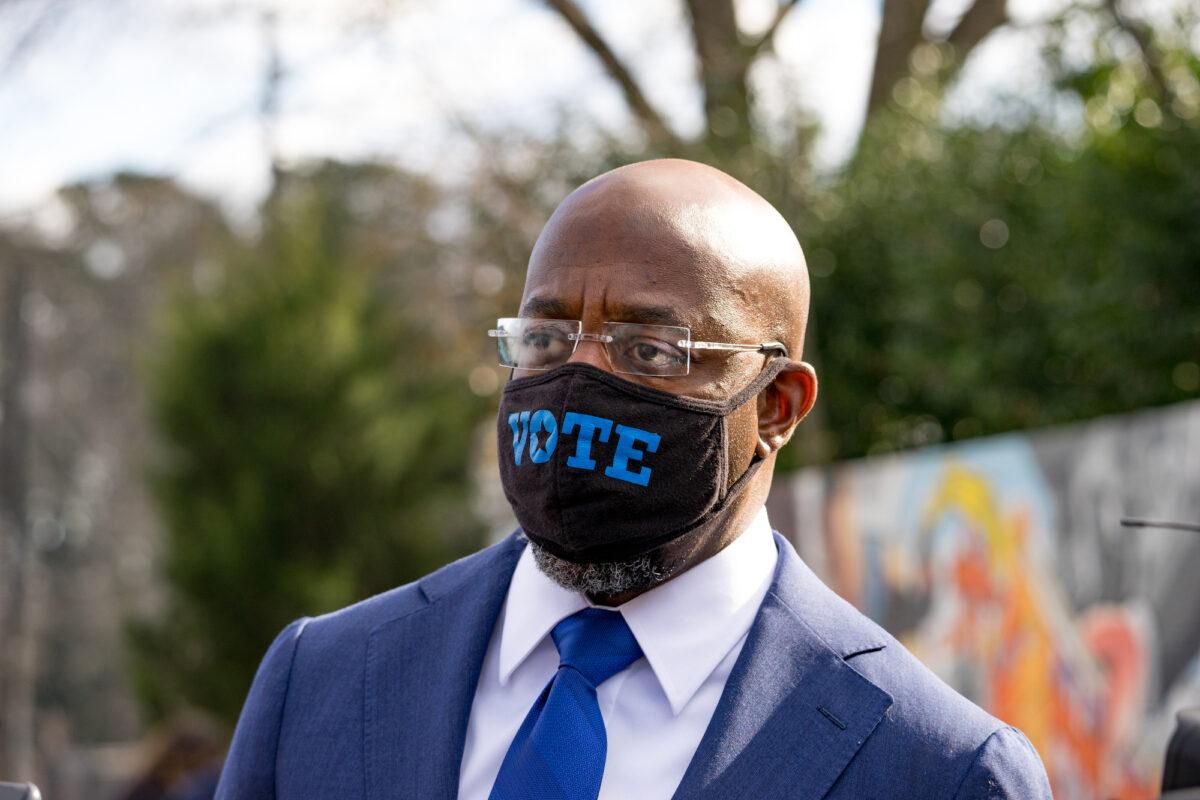 Georgia Democratic Sen. Rev. Raphael Warnock meets with supporters in Marietta, Ga., on Jan. 5, 2021. (Megan Varner/Getty Images)