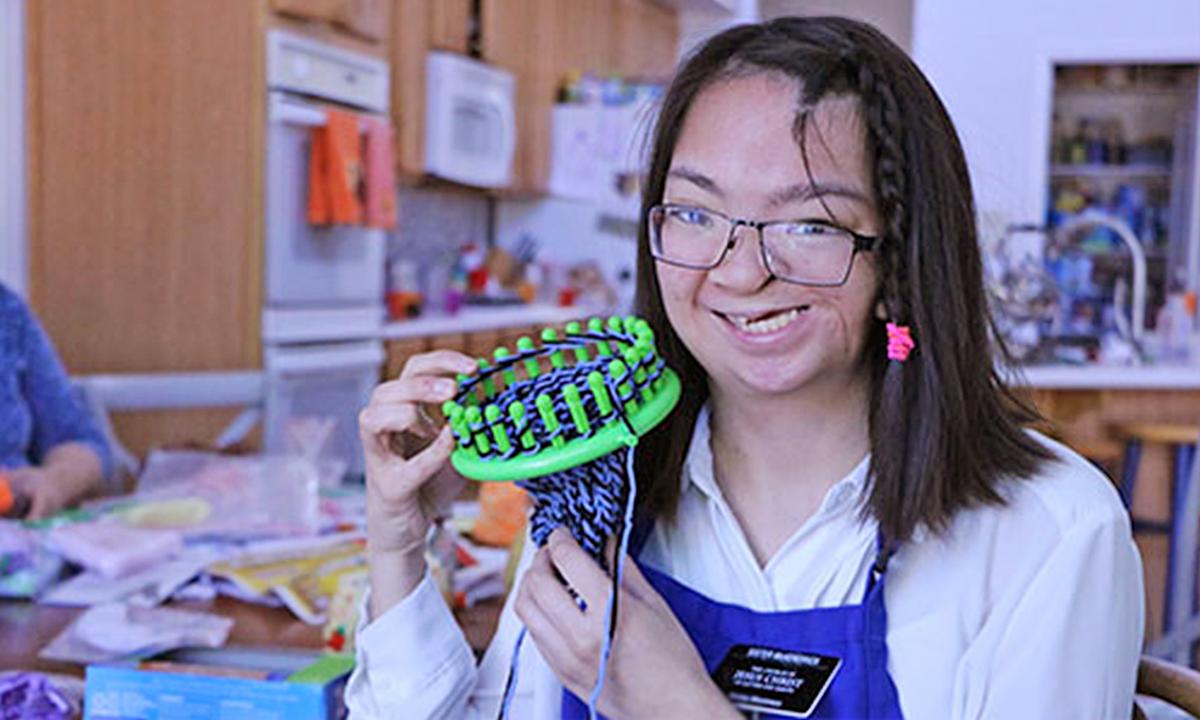 Woman, 23, Who Was Born Premature and With Disabilities Knits Hats to Help Those Like Her