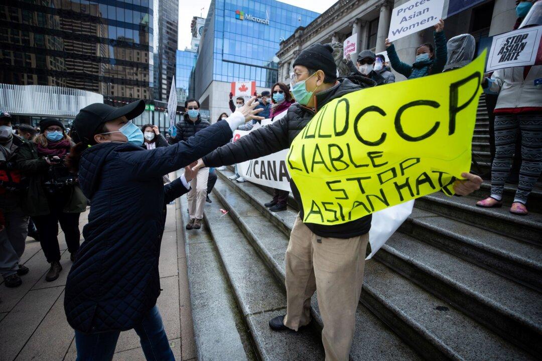 Man Holding Sign Calling for CCP Accountability Is Blocked at Vancouver Anti-Asian Hate Event Organized by Mysterious Group